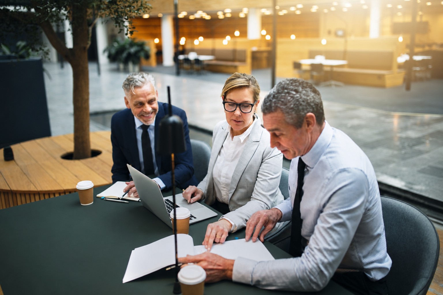 3 people sitting around a table